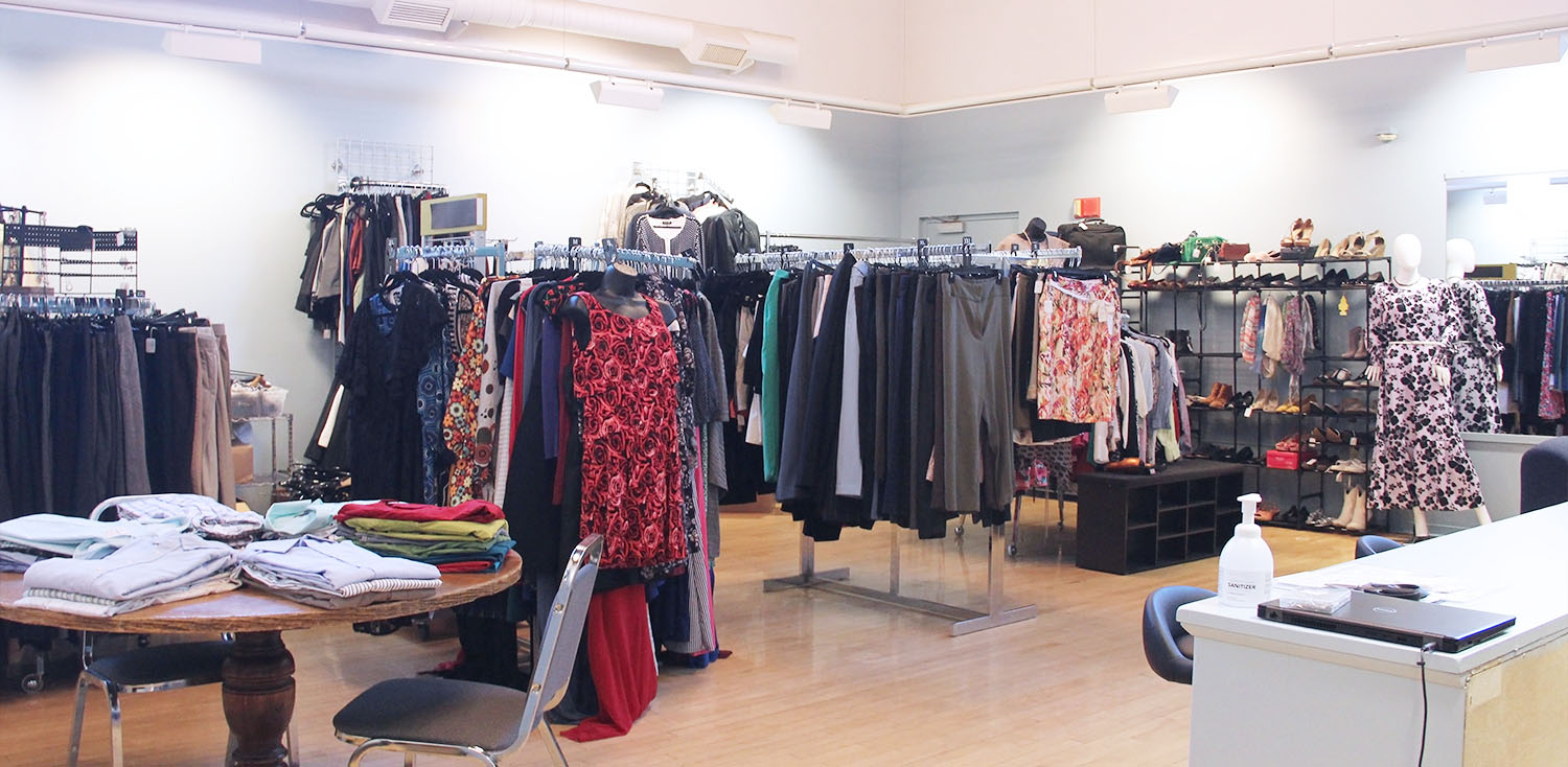 JCC's Career Closet on the Jamestown Campus is a large room with clean professional clothing arranged on hangers, wall mounts, and tables, similar to a department store. Several mannequins wear sample outfits, and at the front of the room is a private changing room and front desk for assistance.