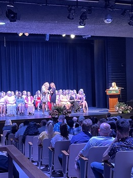 2022 graduates of the Nursing Program at SUNY Jamestown Community College on the stage of the Scharmann Theatre during their pinning ceremony.