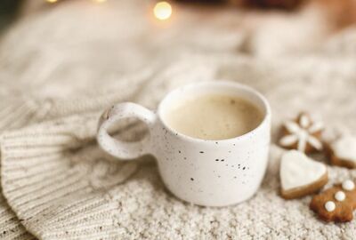 Coffee cup with cookies.