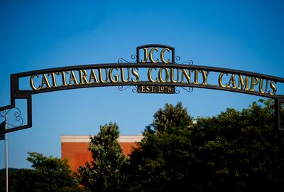 Wrought iron welcoming archway sign that reads JCC Cattaraugus County Campus.